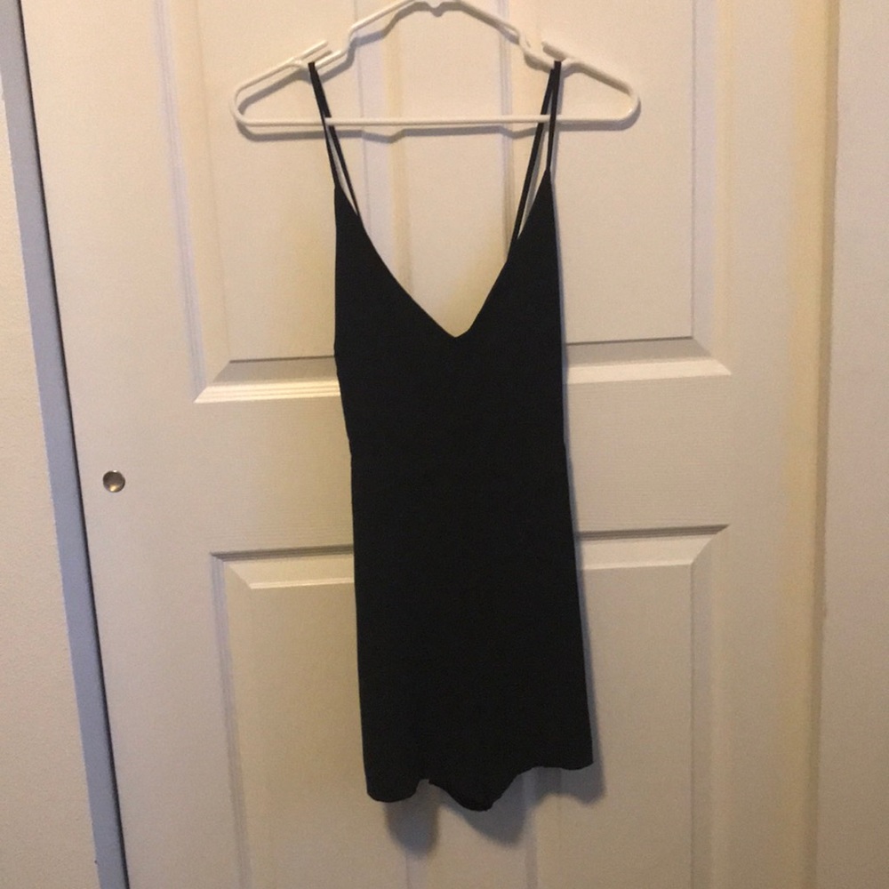 Black romper with cross cross back.